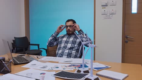 tired engineer taking a break from a complex project