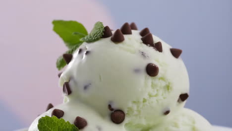 close-up of mint chocolate chip ice cream with mint garnish