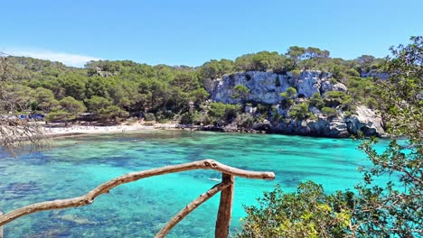 cala macarella it is surrounded by pine forests and is part of the camí de cavalls, a path that runs along the coast of menorca