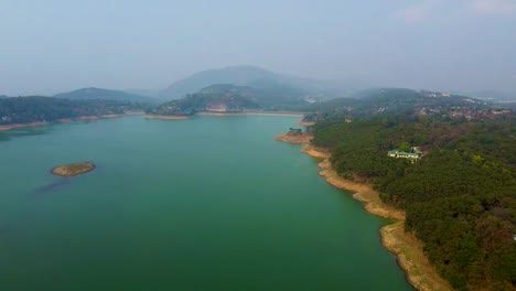 pristine lake at the edge of mountain forests aerial shots at morning video is taken at umiyam lake shillong meghalaya india