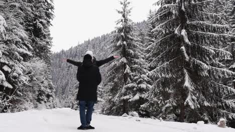 A Loving Couple Tenderly Kisses on a Snowy Road in the Middle of Christmas Trees a Loving Couple Tenderly Kisses on a Snowy Road in the Middle of Christmas Trees Winter Forest