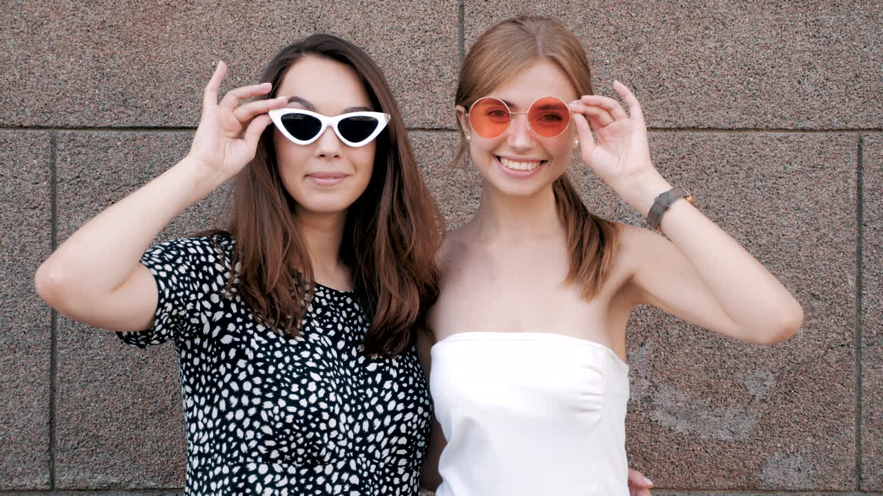 Two young women wearing sunglasses