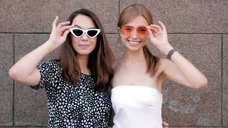 two young women wearing sunglasses