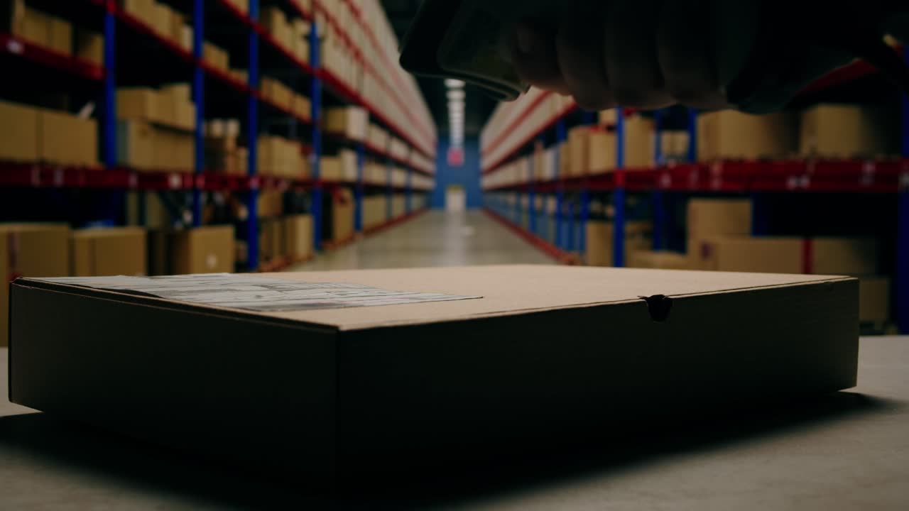 Scanner scan delivery box in storage, E-commerce shop, man packing goods and clothes second hand delivery market, courier Packaging and Shipping Workspace with Supplies and Technology, online sales.