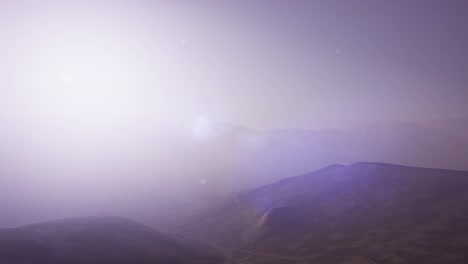 aerial green hills landscape in fog