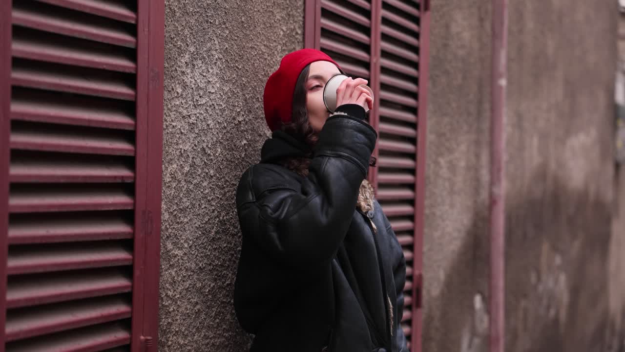 Woman in Red Beret Drinking Coffee Outdoors