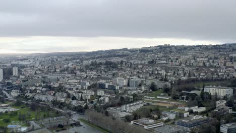 Drone-Aerial-of-the-beautiful-swiss-city-center-of-lausanne-located-on-the-lake-geneva-in-Switzerland-during-winter,-Europe