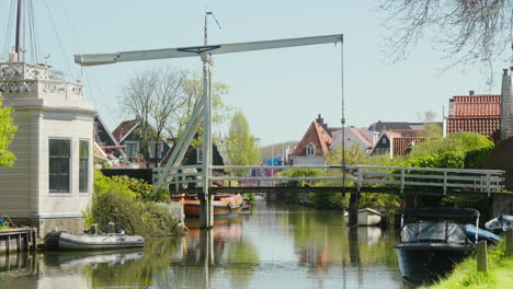 charming edam: sunny day with canals, bridge, and historic buildings in the netherlands