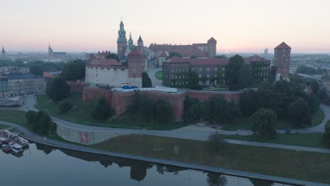 aerial drone shot of krakow poland wawel castle old town with the river vistula at sunrise