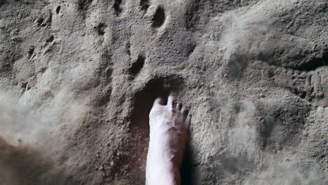 Strong-step-barefoot-into-sand.-Slow-Motion-Pov