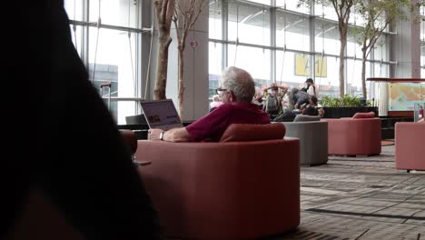 senior couple enjoys leisure time in a busy lounge