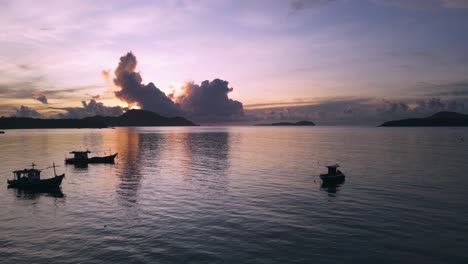 Drone-aerial-during-sunrise-over-tropical-islands-ocean-beach-in-Thailand