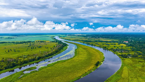 cloudscape over the lielupe river near jelgava, latvia with a directional wind shear pushing clouds in different directions in this picturesque aerial time lapse