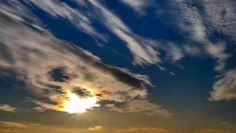 sun and clouds time lapse. sun and moving clouds on blue sky.