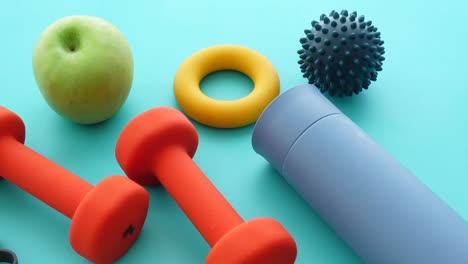 fitness and healthy lifestyle items on blue background