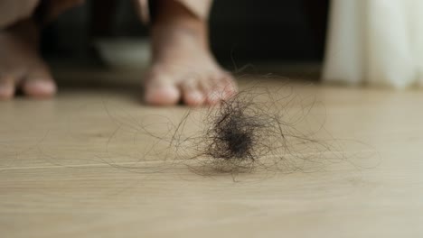 fallen hair on wooden floor