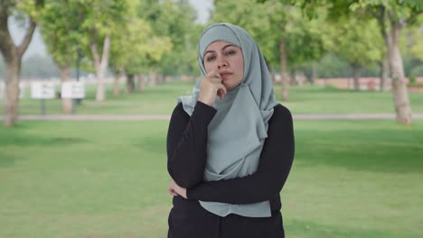 Confused-Muslim-woman-thinking-something-in-park