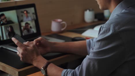 cheerful man having video call with coworkers