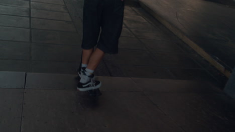 Extreme-boy-jumping-with-scooter-on-ramp-at-urban-skate-park.