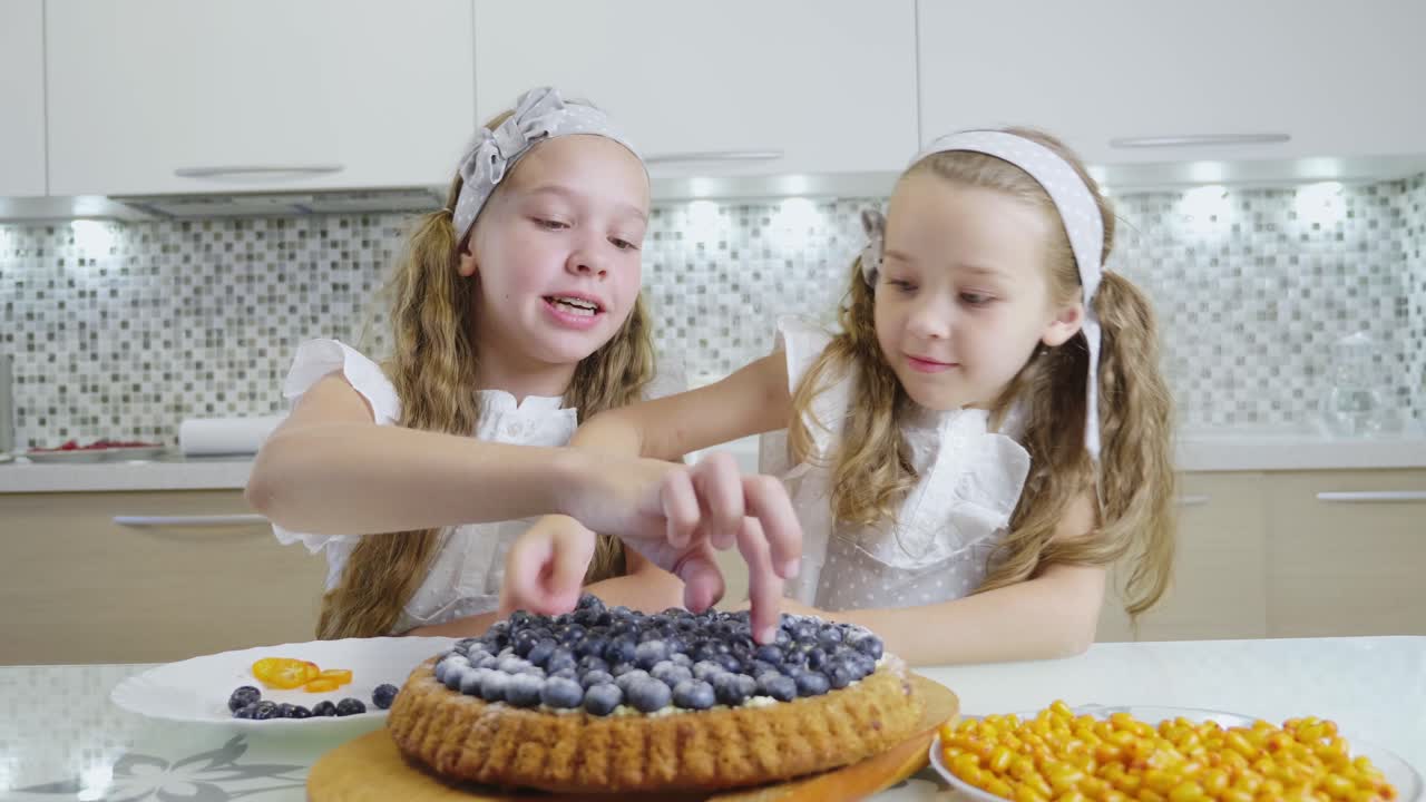 Sisters Sharing a Blueberry Tart