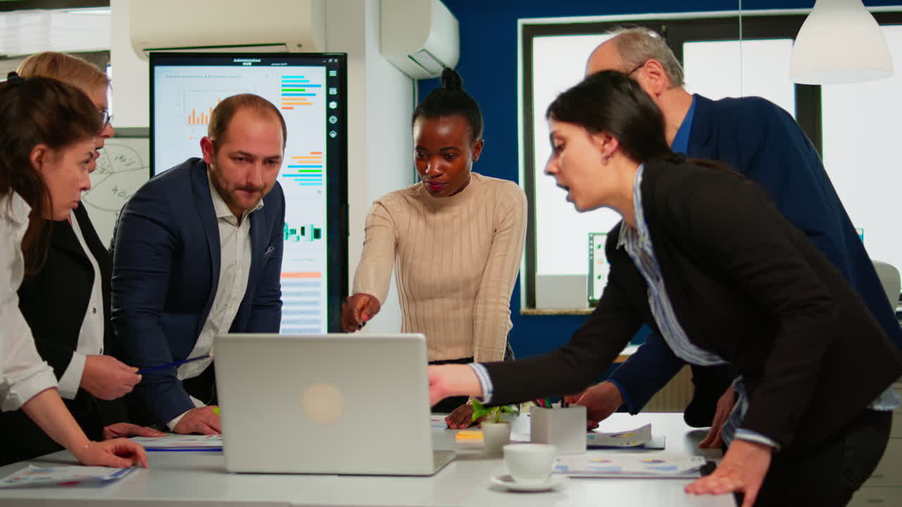 International business team talking to african woman mentor