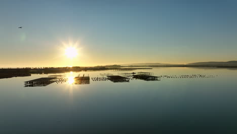 golden hour over etang de vic from above.