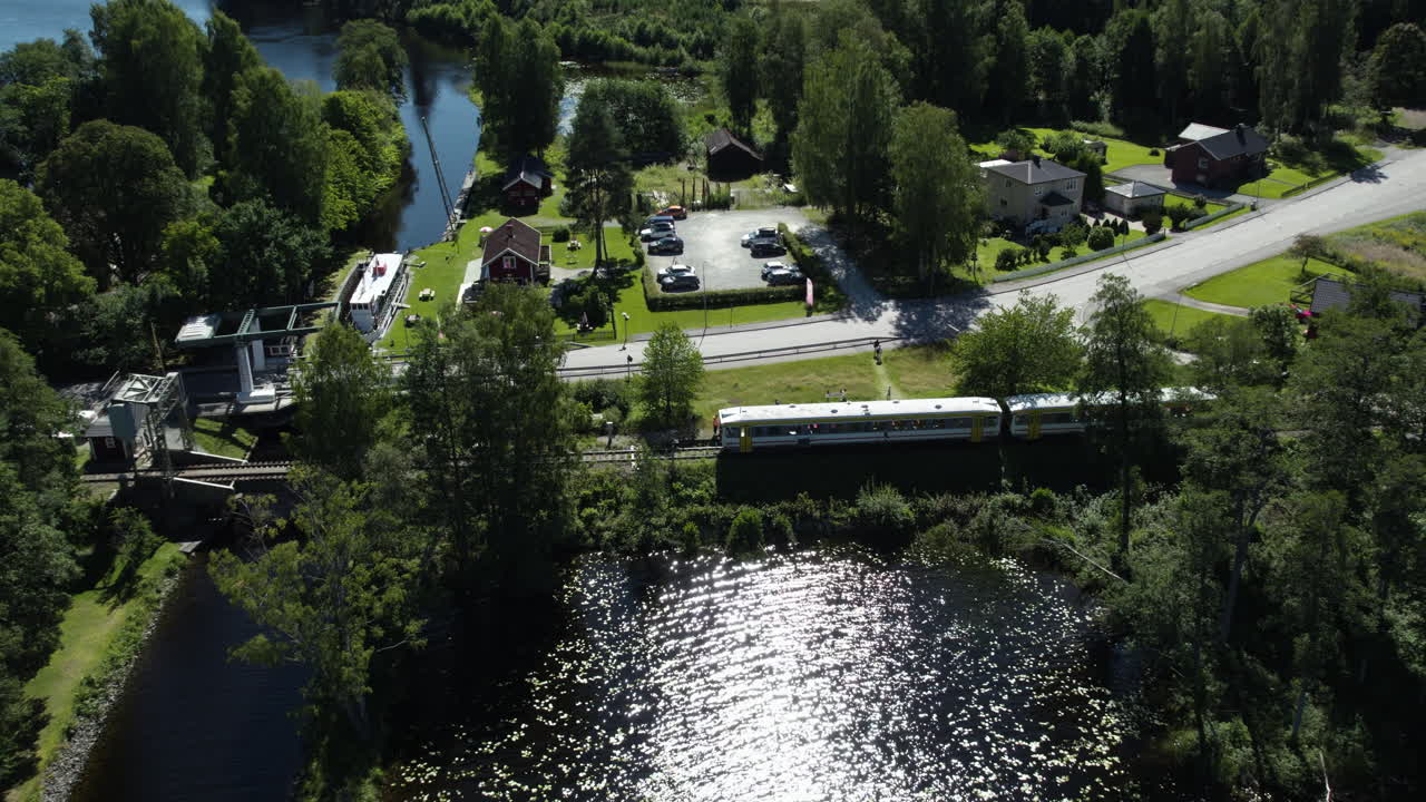 Tourist train moving through scenic nature near the ferry station in Dals-Langed, Dalsland, Sweden