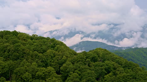 timeless drone footage of smoky mountains fading into clouds and fog