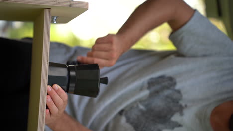 vertical of young digital nomad preparing a coffe in his van rv camping car