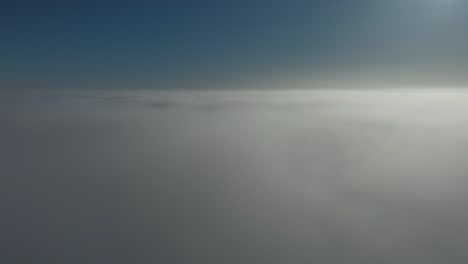 time lapse from above the clouds in sunrise with drone