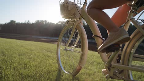 video of unrecognizable person riding a bike on sunset