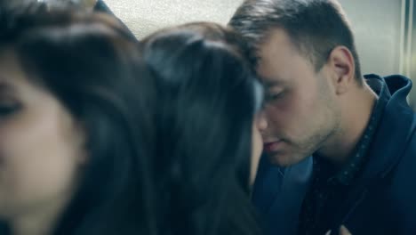 close view young man in black suit near brunette girl