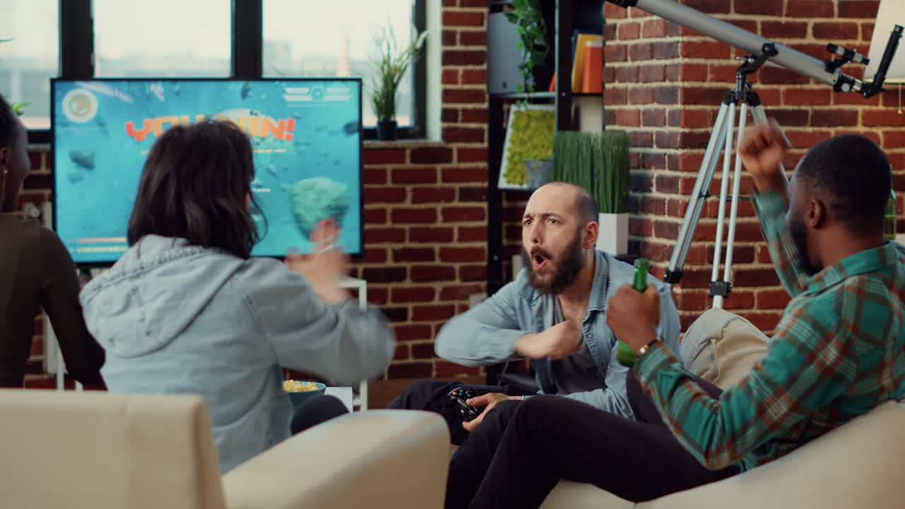 Happy people celebrating video games win on console