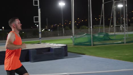 caucasian disabled male athlete with prosthetic leg training, running