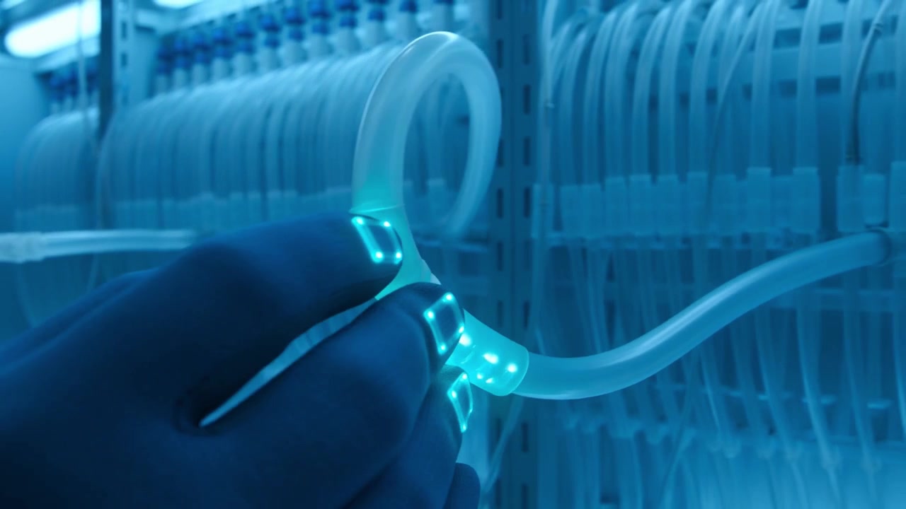 Futuristic Hand in Smart Glove Interacting with Glowing Tube