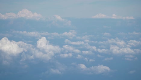 moving shot of clouds in the high sky from airoplane window