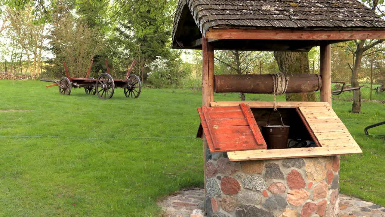 pulling a bucket from a well, winding a rope