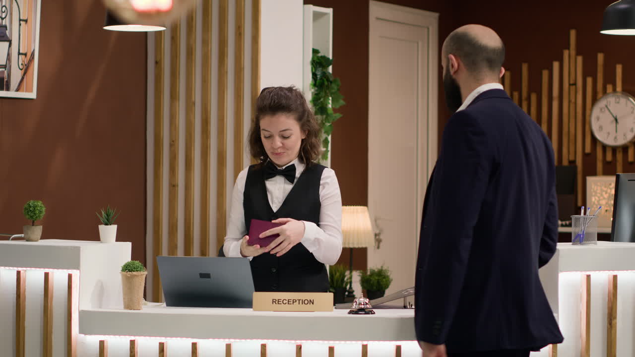 Hotel concierge verifying passport id