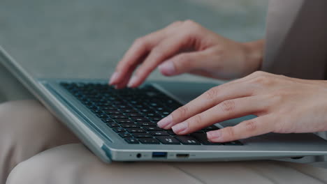 Woman Typing on a Laptop