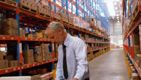 manager holding cardboard box