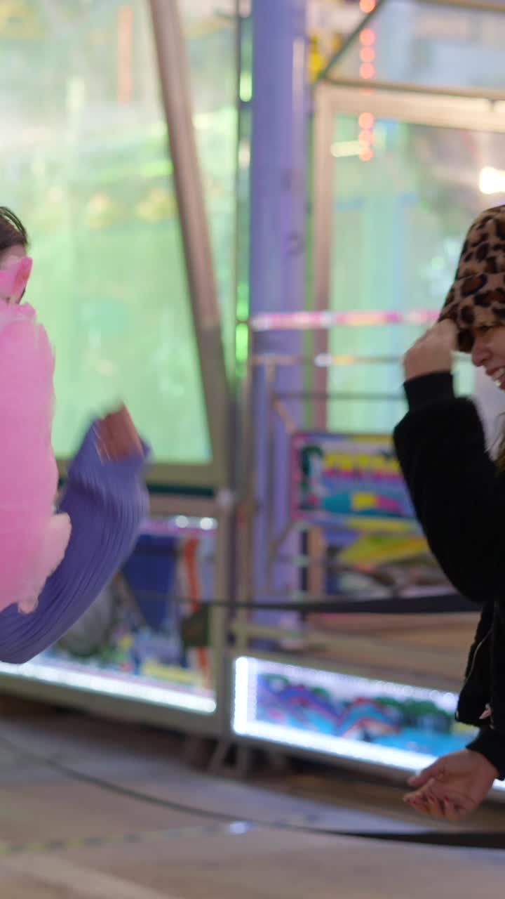 Friends Enjoying Cotton Candy at a Fair