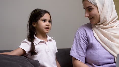 mother and daughter in the living room at home