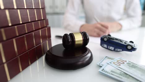 judge gavel with upside down toy car closeup