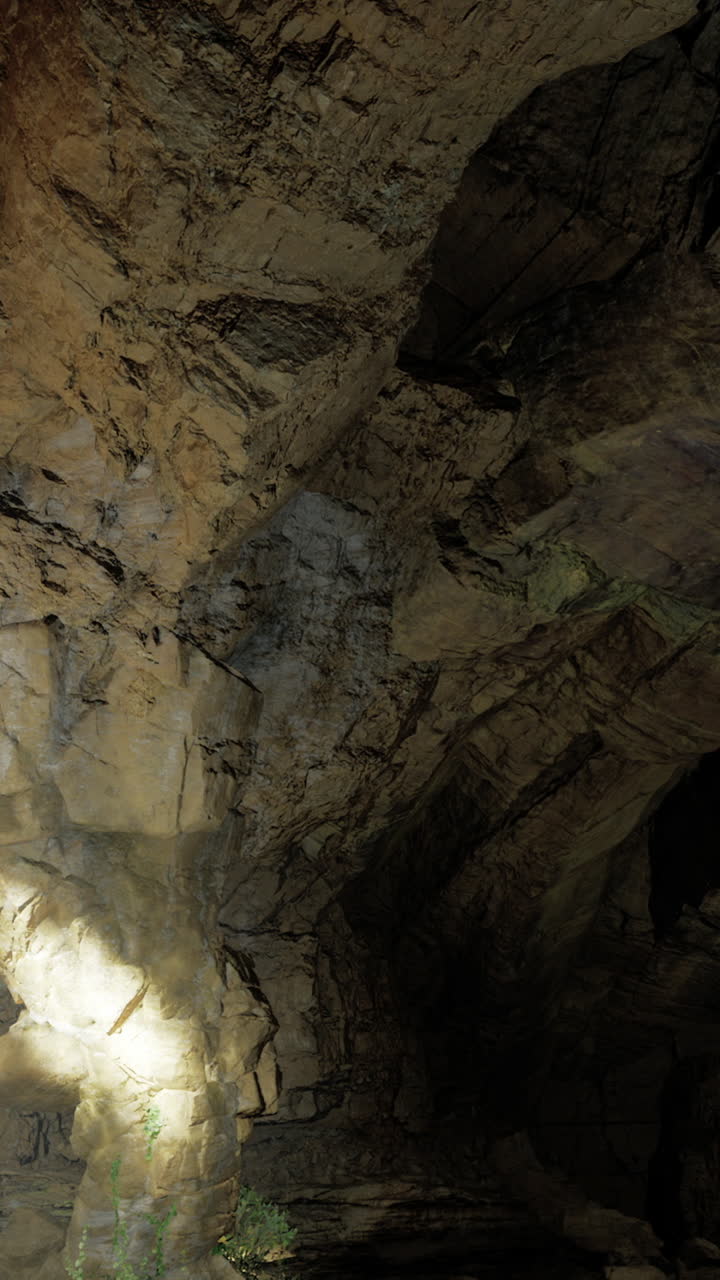 Natural rock cavern illuminated by subtle light during nighttime