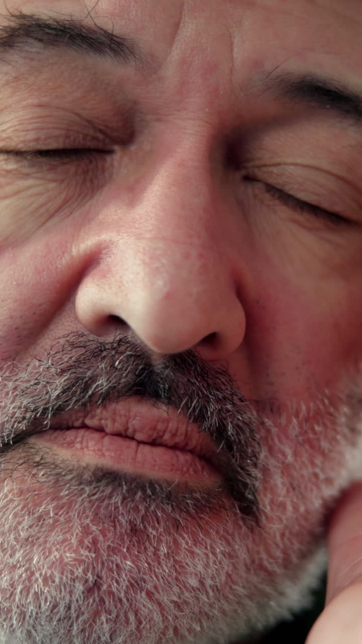 Close-up of a Mature Man's Face with Eyes Closed