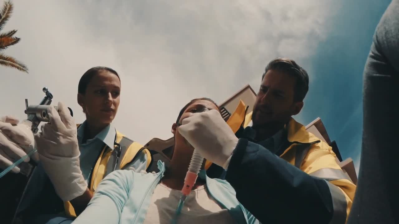 Doctor putting an oxygen mask on patient