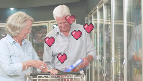 animación de iconos de corazones cayendo sobre una pareja caucásica mayor en la tienda