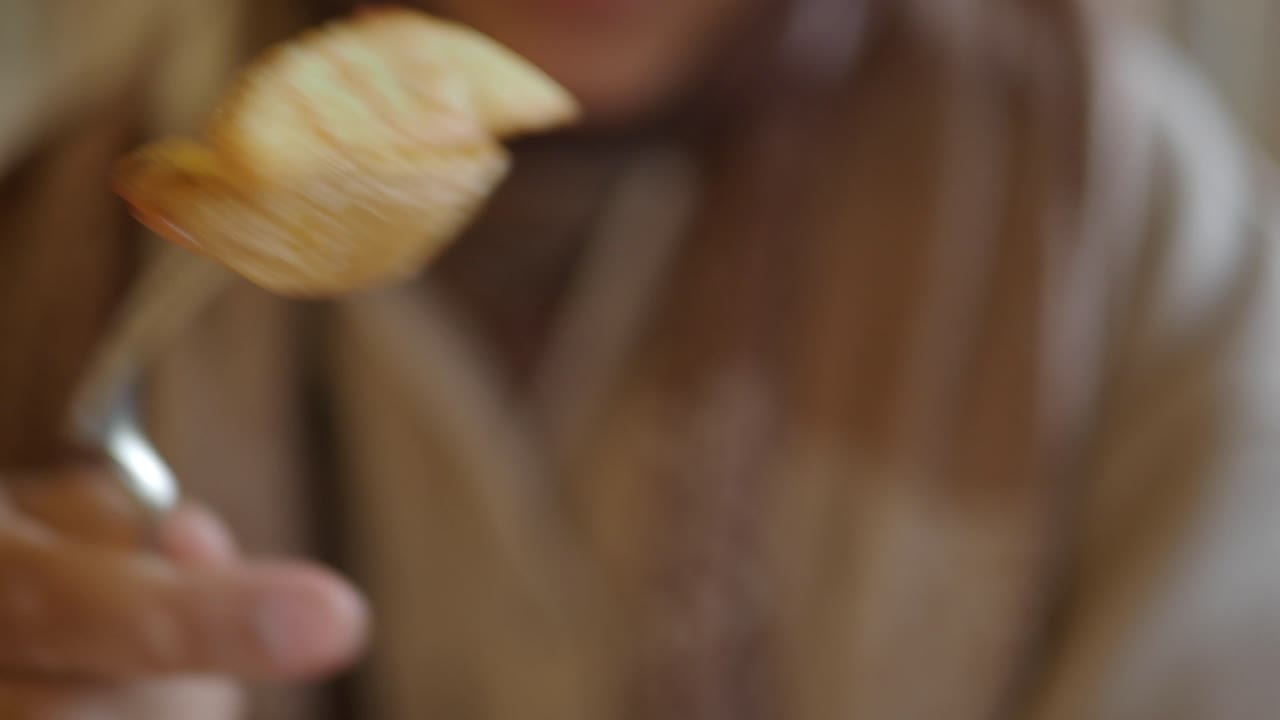 Woman eating potato wedges