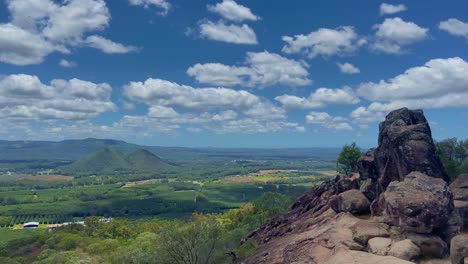 dramatic wide shot looking out over the glasshouse mountains from the summit of mount ngungun