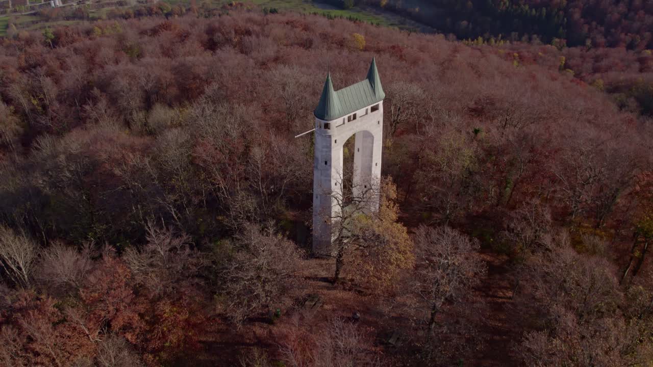 Vibrant fall colors surround Schonbergturm tower in Pfullingen, Germany